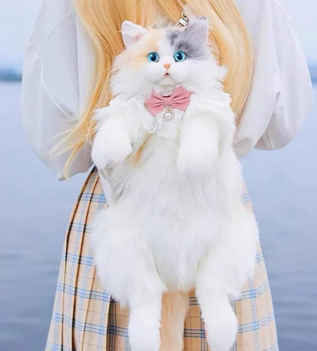 Girl holding cute cat backpack